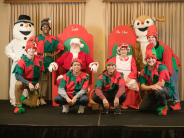 Group Photo of Santa, Mrs. Claus, Snowman, Reindeer, and Elves at Breakfast with Santa