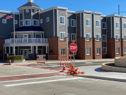 Temporary flashing stop sign at Shawnee Street and Fourth Street. Traffic signals are coming