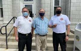 Fire department and city mayor with face masks