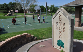 Bob Dougherty Park sign and basketball court