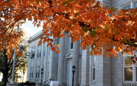page 1 of newsletter shows Leavenworth City Hall with tree with orange leaves