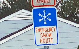 Emergency Snow Route sign with blue and white snowflake