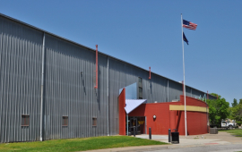 large building with American and Kansas flags