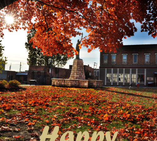 photo of fall leaves at City Hall below the State of Liberty Replica