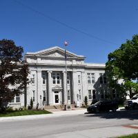 Leavenworth City Hall with green trees and a blue sky