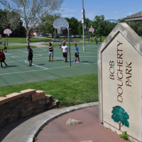 Bob Dougherty Park sign and basketball court