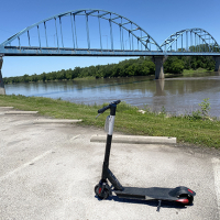photo of a motorized scooter in front of Leavenworth bridge