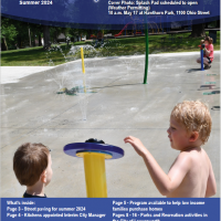 Photo of the front page of the newsletter shows a photo of two young boys pushing the button at the Leavenworth Splash pad