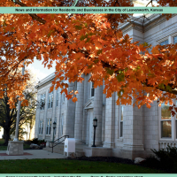 page 1 of newsletter shows Leavenworth City Hall with tree with orange leaves
