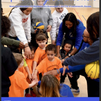 cover of First city connection magazine with photo of children putting their hands in a circle with a coach with a basketball