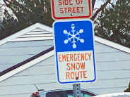 Emergency Snow Route sign with blue and white snowflake